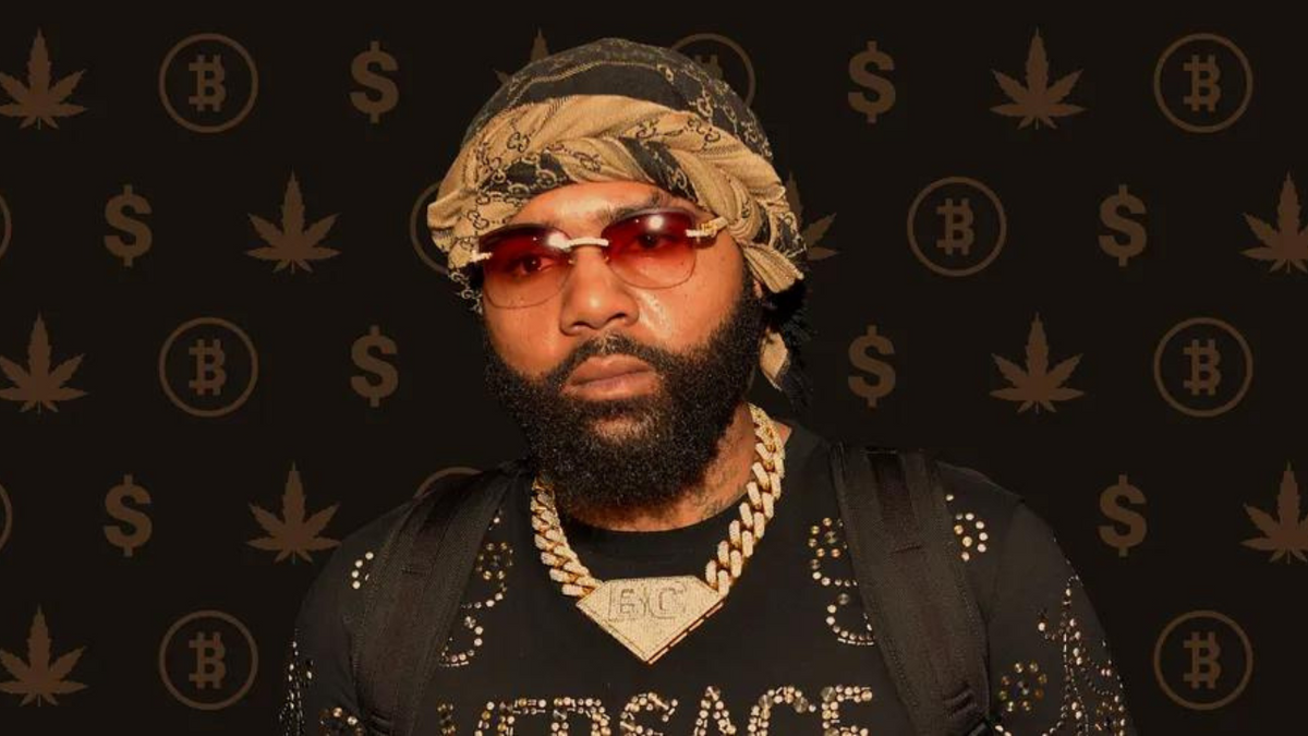 A man is in a recording studio making music.